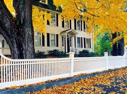 A white home with plenty of windows.