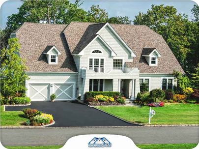 A white home with brown roof.