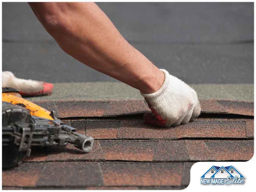 roofer placing shingles